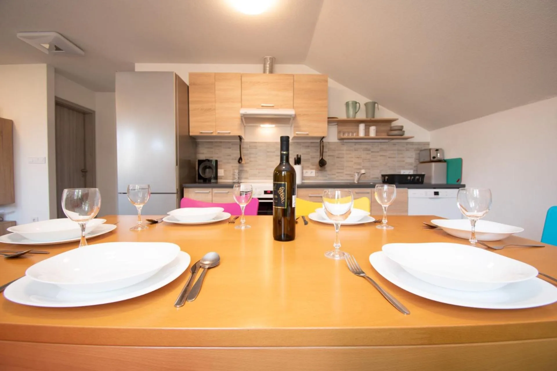Dining table set for dinner inside Vila Damjan