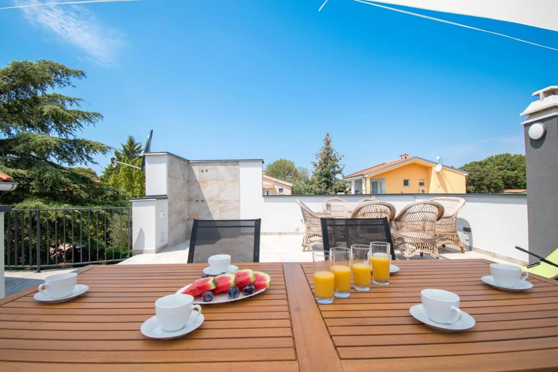 Breakfast table on the upper terrace overlooking the village