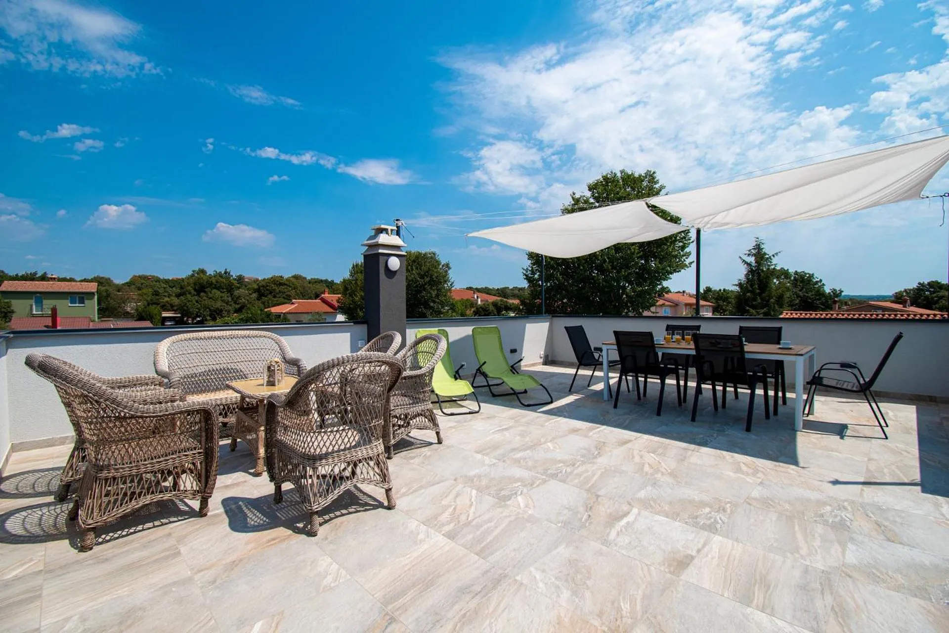 Upper terrace overlooking the pool and village